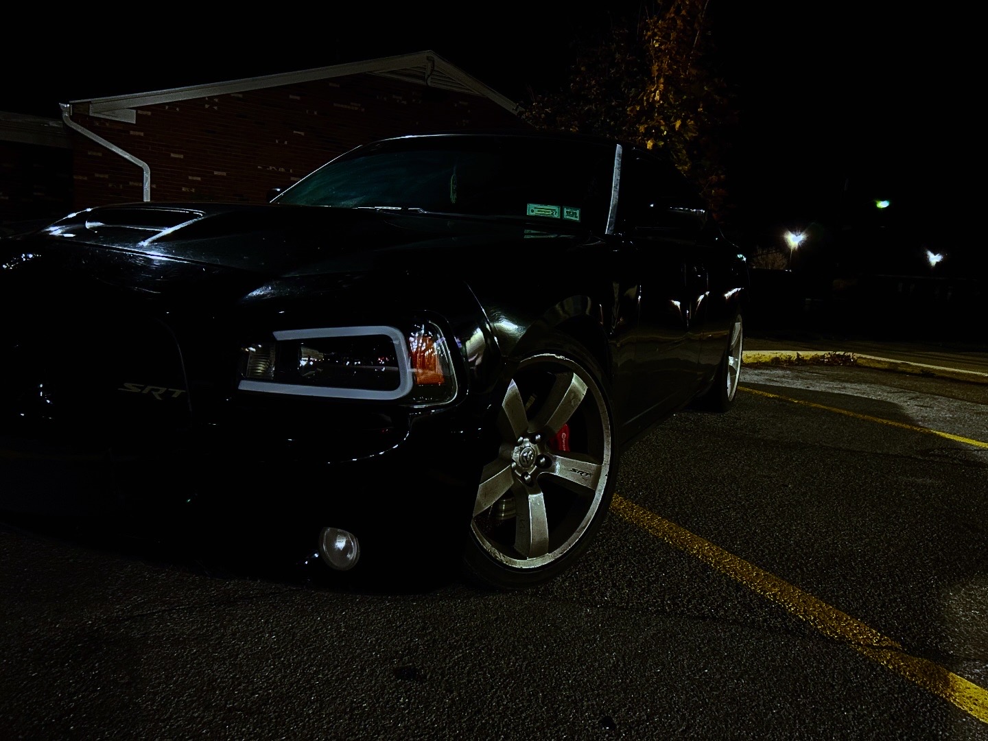 Low angle portrait of a black performance sedan